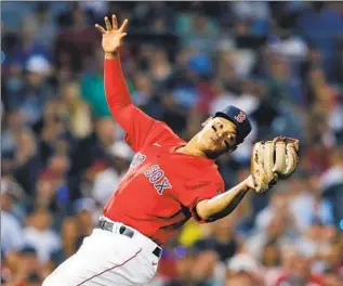  ?? Michael Dwyer Associated Press ?? RAFAEL DEVERS agreed to a one-year, $17.5-million contract to stay with Boston and avoid salary arbitratio­n. In 141 games last year, he batted .295 with 42 doubles, 27 home runs and 88 RBIs.