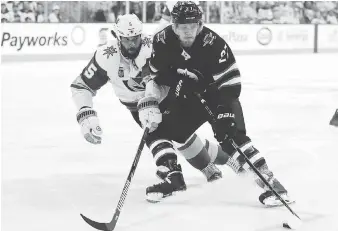  ?? ELSA/GETTY IMAGES ?? Vegas Golden Knights blue-liner Deryk Engelland defends against Winnipeg Jets forward Nikolaj Ehlers. After 13 playoff games, Ehlers has yet to turn on the red light.