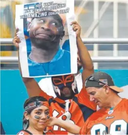  ?? Joe Amon, The Denver Post ?? Broncos fans in Florida display their concern Sunday while watching Denver lose 35-9 to the Miami Dolphins.