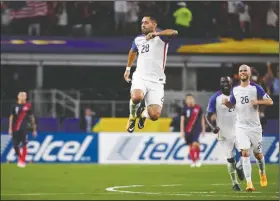  ?? AP/JEFFREY MCWHORTER ?? United States’ Clint Dempsey (28) celebrates with teammates after scoring a goal during a CONCACAF Gold Cup semifinal soccer match against Costa Rica in Arlington, Texas. The U.S. won 2-0 to make the tournament finals.