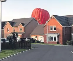  ?? Pictures: Millie Donnelly-Mair ?? The balloon makes its landing.