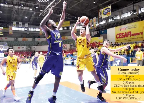  ?? PAUL JUN E. ROSAROSO ?? Mark Kong of CIT-U puts up a shot against UC's import Frederick Elombi during their CESAFI basketball match last night at the Cebu Coliseum. CIT-U won, 81-75, ending UC's 8-0 streak.