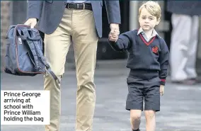  ??  ?? Prince George arriving at school with Prince William holding the bag