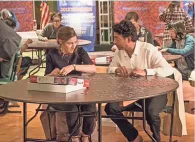  ?? LINDA KALLERUS/SONY PICTURES CLASSICS ?? Kelly Macdonald (left) and Irrfan Khan play two lonely people who bond over their connection with puzzle-making in "Puzzle."