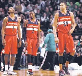  ?? Winslow Townson / Associated Press 2012 ?? Nick Young (left), John Wall and JaVale McGee languished on an awful Wizards team in 2012. Young and McGee became close friends and mutual pranksters while in Washington and are up to their old tricks now that they’re Warriors teammates.