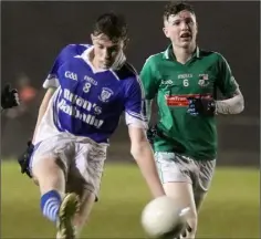  ??  ?? John Kehoe of Ballyhogue delivers the ball beyond Owen Whitty.