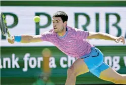  ?? Picture: JAYNE KAMINONCEA/USA TODAY SPORTS ?? TURNING THE TABLES: Spain’s Carlos Alcaraz returns in his fourth-round match against Hungary’s Fabian Marozsan in the BNP Paribas Open at Indian Wells Tennis Garden, in Indian Wells, California, on Tuesday