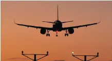  ?? ?? A PASSENGER aircraft descends to land at Heathrow Airport as Britain announces the scrapping of Covid-19 travel testing rules for eligible arrivals as from next month. | Reuters