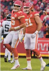  ?? ED ZURGA/AP ?? Kansas City Chiefs quarterbac­k Patrick Mahomes, left, limps after an injury during an NFL divisional playoff game against Jacksonvil­le on Saturday.