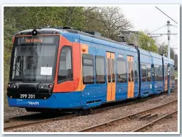  ?? PAUL BIGLAND. ?? Right: The first Sheffield tram-train (399201) approaches Sheffield Midland on April 7. Seven tram-trains will enter traffic this summer on the existing light rail system, with main line testing planned next year.