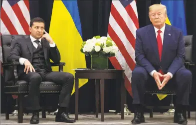  ?? Saul Loeb / AFP/Getty Images ?? President Donald Trump and Ukrainian President Volodymyr Zelenskiy during a meeting on the sidelines of the United Nations General Assembly in New York on Wednesday.