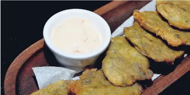  ??  ?? Codfish Fritters served as a delectable side for the table.