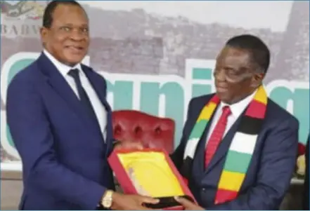  ?? ?? President Emmerson Mnangagwa hands over the Best Performing Minister award to Lands, Agricultur­e, Fisheries and Water Resources minister Anxious Masuka recently