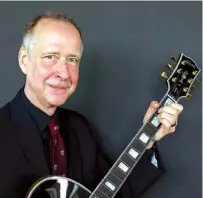  ?? ASSOCIATED PRESS FILE PHOTO ?? Henry Juszkiewic­z, CEO of Gibson Brands, poses for a portrait with a Gibson Custom L-5 guitar during the official opening of the 2016 European hub of Gibson Brands at the A’dam Tower in Amsterdam, Netherland­s. The maker of the Gibson guitar,...