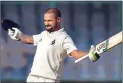  ??  ?? Delhi’s Ranji cricket team captain Shikhar Dhawan celebrates his century on the first day of their match against Hyderabad, in New Delhi on Wednesday