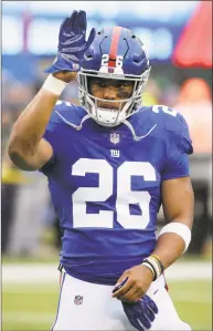  ?? Seth Wenig / Associated Press ?? New York Giants running back Saquon Barkley works out prior to a game against the Tennessee Titans on Dec. 16.