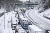  ?? DAVE KILLEN — THE OREGONIAN VIA AP ?? The backup of cars and trucks stuck on Interstate 84is seen from the Blumenauer Bicycle and Pedestrian Bridge in Northeast Portland, Ore., on Thursday.