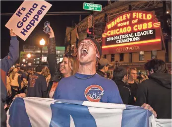  ?? ASHLEE REZIN, CHICAGO SUN-TIMES, VIA AP ?? Cubs fans enjoy a wild celebratio­n Saturday after their team clinched its World Series berth.