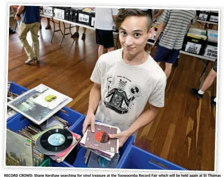  ?? Photo: Nev Madsen ?? RECORD CROWD: Shane Kershaw searching for vinyl treasure at the Toowoomba Record Fair which will be held again at St Thomas More’s Hall today.