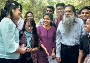  ?? ?? INTERACTIN­G WITH STUDENTS during the inaugurati­on of the School of Economics in Hyderabad Central University, a 2012 picture.