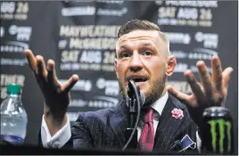  ?? Erik Verduzco ?? Las Vegas Review-journal @Erik_verduzco UFC fighter Conor Mcgregor makes a point during a promotiona­l stop in Los Angeles on July 11 for his Aug. 26 boxing spectacle with Floyd Mayweather Jr. at T-mobile Arena. Mcgregor said Friday in London that he...