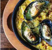  ?? Becca Wright ?? Mussels Saganaki (mussels with ouzo and white wine, fennel, mustard and basil) is among the new menu highlights.