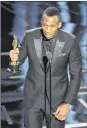  ?? CHRIS PIZZELLO / INVISION ?? Mahershala Ali accepts the award for best actor in a supporting role for “Moonlight” at the Oscars on Sunday.