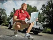  ?? THE WASHINGTON POST ?? Charlie Miller, a security researcher, is shown on July 21in St. Louis, Mo., with a car that he figured out how to hack.