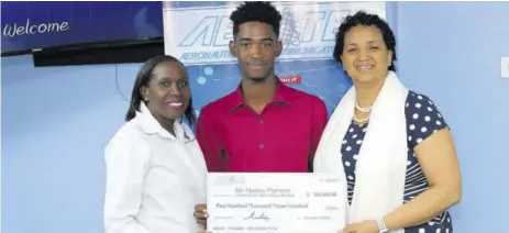  ??  ?? Scholarshi­p officer at the University of Technology, Jamaica Pauline Madourie (left) and dean of the Faculty of Engineerin­g and Computing Professor Nilza Aples flank the Aerotel Scholarshi­p awardee for 2018-2010, Navion Plummer.