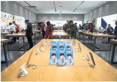  ?? — Bloomberg ?? Listing exercise: A Xiaomi store in Beijing. The smartphone maker filed for an IPO in Hong Kong yesterday, kicking off a process that’s expected to raise at least US$10bil.