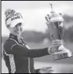  ?? Associated Press ?? Nelly Korda shows the championsh­ip trophy after winning the LPGA Pelican Women’s Championsh­ip golf tournament at Pelican Golf Club, Sunday, in Belleair, Fla.