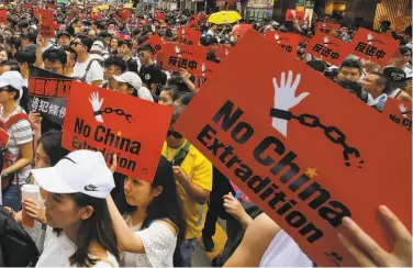  ?? Kin Cheung / Associated Press ?? Protesters rally against a proposal that would allow criminal suspects to be extradited to mainland China.