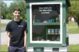  ?? CHARLES PRITCHARD - ONEIDA DAILY DISPATCH ?? VVS High School Senior Adam Fellows stands next to his food pantry in Sherrill on Friday.