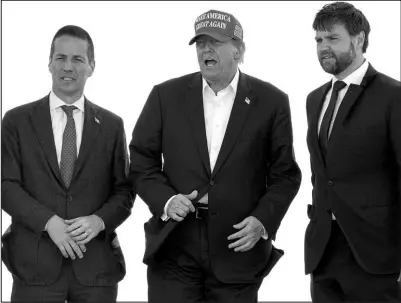  ?? JEFF DEAN / ASSOCIATED PRESS ?? Former President Donald Trump, center, is joined by Senate candidate Bernie Moreno, left, and Sen. J.D. Vance at a campaign rally March 16 in Vandalia, Ohio.