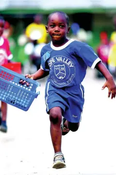  ?? RICARDO MAKYN/CHIEF PHOTO EDITOR ?? Four-year-old Tad-Wynn Lawson of Pringle House runs away from his competitor­s in the boys’ potato race at Hope Valley Experiment­al School’s sports day, held on the grounds yesterday.