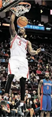  ?? Smiley N. Pool / Houston Chronicle ?? Rockets small forward Jordan Hamilton dunks for two of his 13 points as an emergency starter for Chandler Parsons, who was too ill to play.