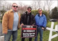  ?? Christian Abraham / Hearst Connecticu­t Media ?? Neighbors on Tranquilit­y Drive led by Joseph Calzone, center, are fighting a proposed commercial chicken coop and slaughterh­ouse in their neighborho­od in Easton on Friday. Posing with Calzone is Sam Ogrodowski, left, and John Allan.