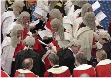  ?? ?? BEWIGGED CABAL: Peers mingle with Law Lords at State Opening of Parliament