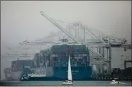  ?? ARIC CRABB — STAFF PHOTOGRAPH­ER ?? Boats maneuver along the Oakland Estuary in Alameda as a smoke-filled sky sits over the Bay Area on Sunday.