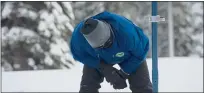  ?? RANDALL BENTON — THE ASSOCIATED PRESS ?? Sean de Guzman, chief of snow surveys for the California Department of Water Resources, checks the depth of the snowpack during the first snow survey of the season at Phillips Station near Echo Summit on Dec. 30, 2021.