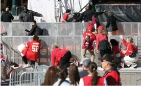  ?? ?? People take cover during a shooting at Union Station during the Kansas City Chiefs’ Super Bowl LVIII victory parade. Photograph: Jamie Squire/Getty Images