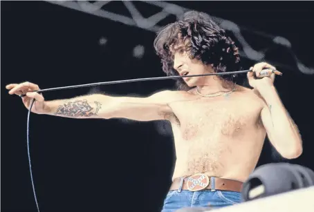  ??  ?? Bon Scott performing with AC/DC at Wembley Stadium on August 18 1979. Picture: Getty.