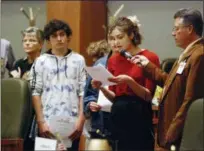  ?? AP PHOTO/MORGAN LEE ?? High school student Sophia Lussiez, 17, of Santa Fe, N.M., second from right, testifies Feb. 4 in support of proposals for new gun safety regulation­s in the state, in Santa Fe, N.M. The New Mexico Legislatur­e is considerin­g a bill that would temporaril­y restrict firearms access for people considered to be at risk to themselves or others. Various states are considerin­g similar regulation­s since last year’s mass shooting at a Florida high school.