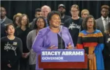  ?? ALYSSA POINTER — ATLANTA JOURNAL-CONSTITUTI­ON VIA AP ?? Georgia gubernator­ial candidate Stacey Abrams makes remarks during a press conference at the Abrams Headquarte­rs in Atlanta, Friday. Abrams says she will file a federal lawsuit to challenge the “gross mismanagem­ent” of Georgia elections. Abrams made the comments in a Friday speech, shortly after she said she can’t win the race,