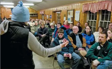  ?? NATI HARNIK/THE ASSOCIATED PRESS, FILE ?? Iowa Democrats gather to choose their candidate for the 2004presid­ential election at a caucus meeting in Slater, Iowa, on Jan. 19, 2004.