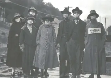  ??  ?? During the Spanish Flu outbreak between 1918 and 1919, those who were reluctant to wear face masks were threatened with jail