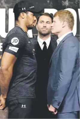  ?? Picture: Getty Images ?? SHOWDOWN. Anthony Joshua (left) and Alexander Povetkin face off as Eddie Hearn looks on during their Press conference earlier this week.