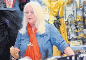  ?? MARLA BROSE/JOURNAL ?? Susan Ricker, owner of Off Broadway, a Nob Hill vintage and costume boutique, says she was promised new sidewalks in front of her shop as part of ART constructi­on. Those sidewalks never materializ­ed.