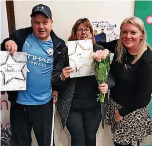  ?? ?? ●●Craig Williams and wife Louise receive their awards from Slimming World leader Julie Bowden (right)