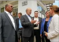  ?? PETE BANNAN – DIGITAL FIRST MEDIA ?? In this file photo, Gov. Tom Wolf, center, talks with state Rep. Harry Lewis Jr., R-74 of Caln, left, Coatesvill­e City Manager Mike Trio, Chester County Commission­er Kathi Cozzone, and Sonia Huntzinger of the Coatesvill­e 2nd Century Alliance during...